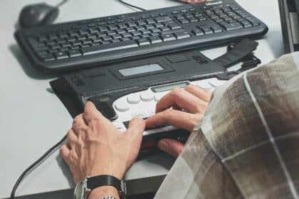 person holding black plastic case